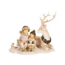 VAKKER FIGUR, BARN MED LIGGENDE REINSDYR, H 16 CM